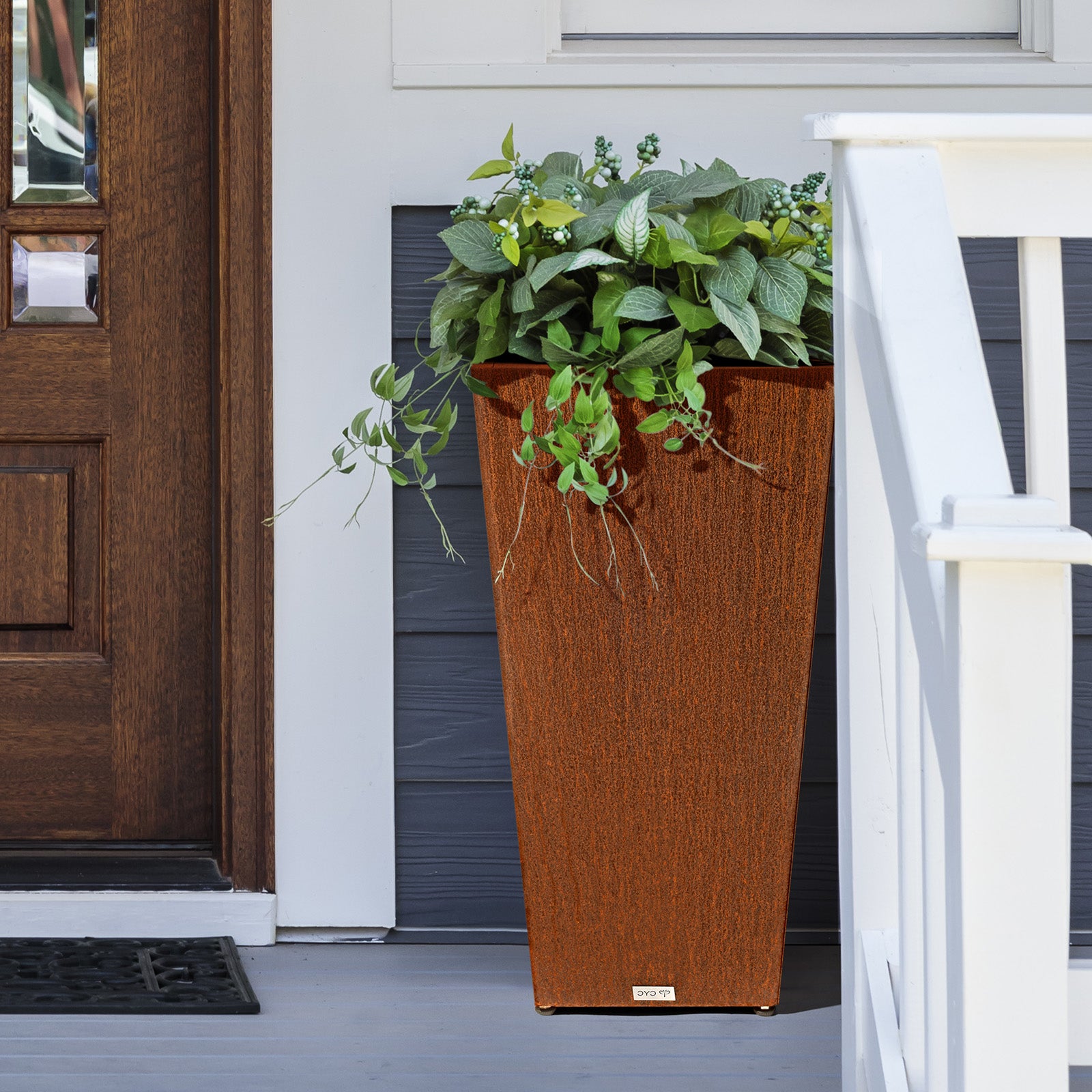 Tall_tapered_corten_steel_planter_decorating_corner